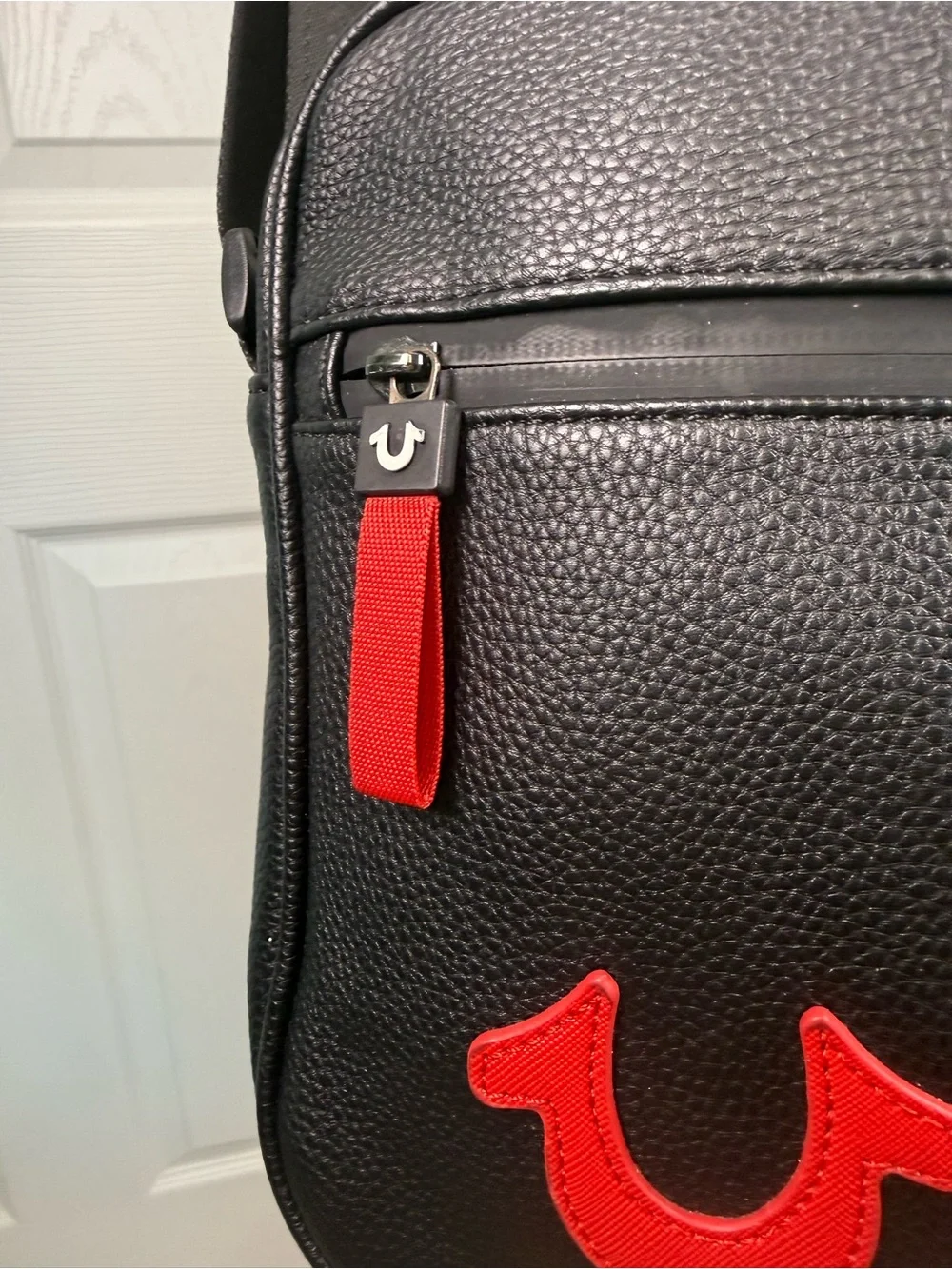 True Religion Nowak Crossbody Bag Black Faux Leather Red Zipper Logo Excellent